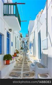 Perspective of old street with whitewashed houses in Mykonos island, Chora town, Greece
