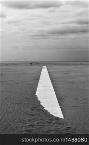 Perspective of path on sandy beach - Minimalistic landscape, black and white photography