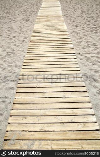 Perspective of wooden path at sandy beach