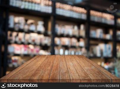 Perspective tabletop wooden with blurred cafe background. product display template
