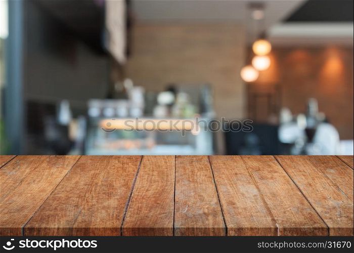 Perspective top brown wooden with blurred coffee shop. product display template