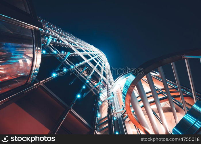 Perspective view on modern skyscraper, bottom view to the beautiful contemprorary steel facade of a luxury high-rise building in Dubai, expensive life concept. Perspective view on modern skyscraper