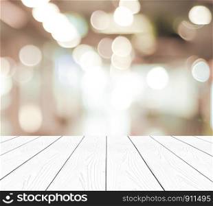 Perspective white wood and blurred store with bokeh background, product display montage