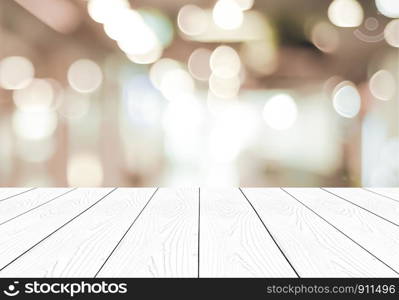 Perspective white wood and blurred store with bokeh background, product display montage