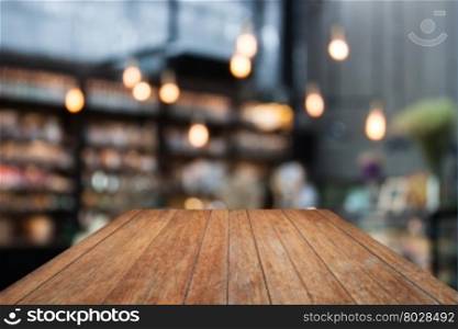 Perspective wooden on coffee shop blurred background with bokeh, stock photo