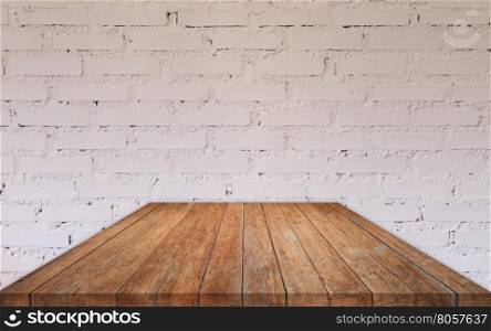 Perspective wooden table top with brick wall decorated in coffee shop