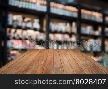 Perspective wooden with coffee shop blurred background with bokeh, stock photo