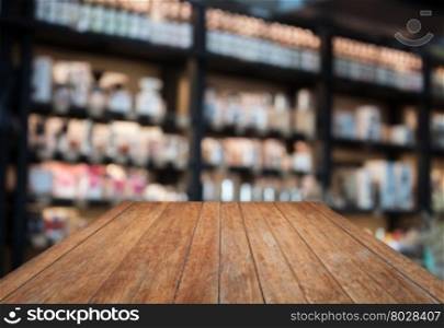 Perspective wooden with coffee shop blurred background with bokeh, stock photo