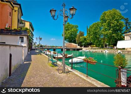 Peschiera del Garda colorful harbor and boats view, Lago di Garda, Veneto region of Italy