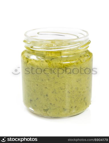 pesto sauce in jar isolated on white background