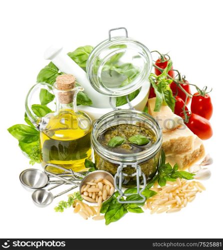 Pesto sauce ingredients on white background. Olive oil, basil, parmesan, pine nuts, tomato. Healthy food. Organic nutrition