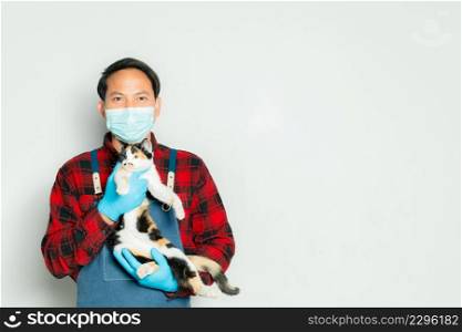 Pet owner affectionately holds a cat of 3 colors.
