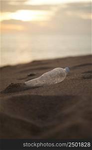 PET Plastic bottle trash on shore beach