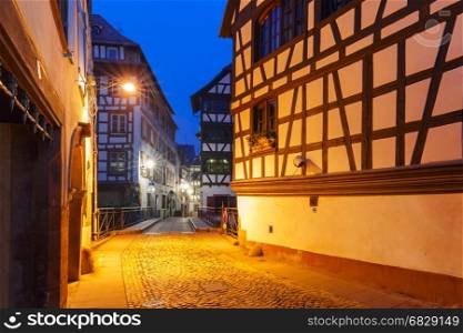 Petite France in the morning, Strasbourg, Alsace. Traditional Alsatian half-timbered houses in Petite France during morning blue hour, Strasbourg, Alsace, France