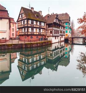 Petite France in the morning, Strasbourg, Alsace. Traditional Alsatian half-timbered houses in Petite France with mirror reflections in the morning, Strasbourg, Alsace, France