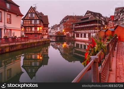Petite France in the morning, Strasbourg, Alsace. Traditional Alsatian half-timbered houses in Petite France with mirror reflections in the morning, Strasbourg, Alsace, France