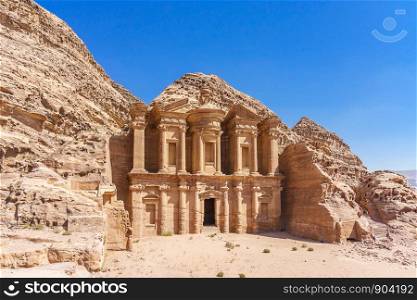 PETRA, JORDAN - OCTOBER 13, 2018: Famous facade of Ad Deir in ancient city Petra, Jordan. Monastery in ancient city of Petra. The temple of Al Khazneh in Petra is one of UNESCO World Heritage Sites and one of the world wonders
