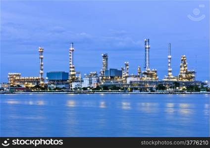 Petrochemical factory illuminated at twilight