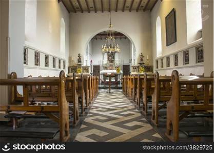 pews and inside church in holset village in holland