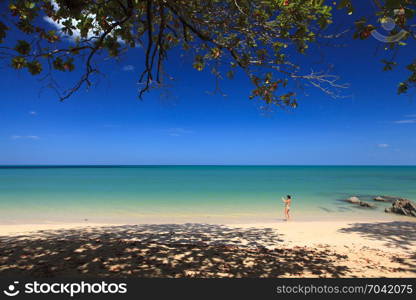 PHANG NGA, THAILAND - FEBRUARY 14: Tourist is taking photos on the beach in the morning at Khaolak beach on the February 14, 2013 in Phang Nga, Thailand