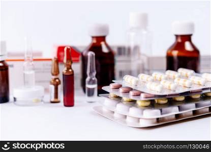 Pharmaceutical colorful pills, capsules, ampoules  on white background