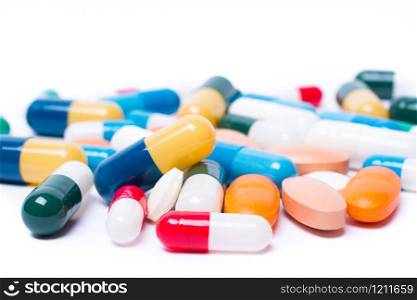 Pharmaceutical medicament, with colored pills and capsule on white background. Drug prescription for treatment medication.