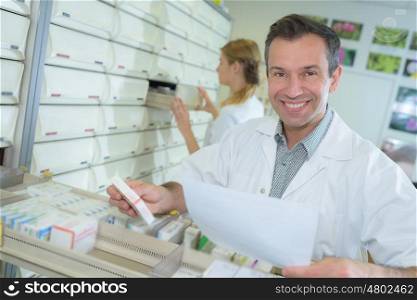 pharmacist presenting ranging medication