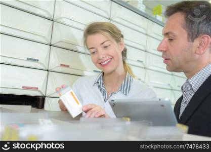 pharmacy manager inspecting the medicines