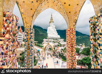 PHETCHABUN, THAILAND - JUNE 29, 2019: Tourist come to visit the beautiful of big five white buddha statue in Wat Phra That Pha Sorn Kaew with beautiful sky background, Phetchabun, Thailand.
