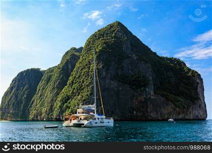 phi phi island kra bi Thailand- December 6,2018 beautiful seascape and tourists boat high season summer holiday on phi phi island with mountain and blue sky background