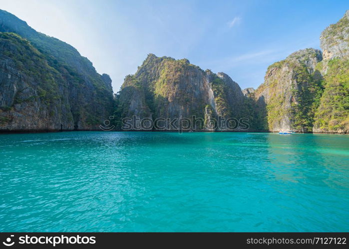 Phi Phi, Maya beach with blue turquoise seawater, Phuket island in summer season during travel holidays vacation trip. Andaman ocean, Thailand. Tourist attraction with blue cloud sky.