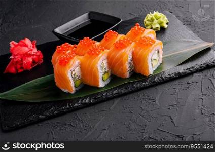 Philadelphia roll sushi with salmon on a dark background