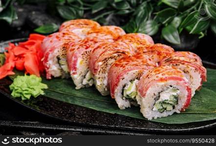 Philadelphia sushi rolls with filling of cream cheese, cucumbers with fresh tuna fillet