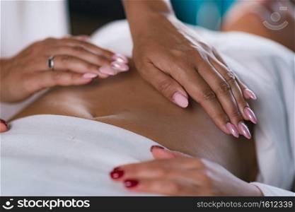 Philippine Psychic Surgery Healer Doing Treatment with Female Patient. Holding her Hands Above Patient’s Stomach. Philippine Psychic Surgery Treatment