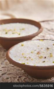 Phirni in clay bowls on table