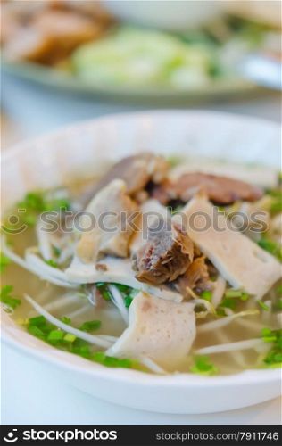 Pho Bo - Vietnamese fresh rice noodle soup with beef, herbs and vegetable