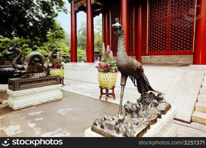 Phoenix statue in front of a building, Summer Palace, Beijing, China