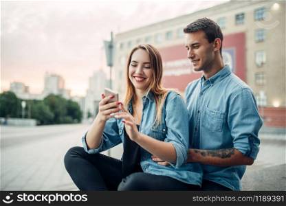 Phone addict couple cannot live without gadgets, addiction problem, social addicted people, modern lifestyle