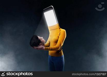 Phone addicted people concept. Female body with a smartphone instead of a head. Manipulation of consciousness. Scaling effect