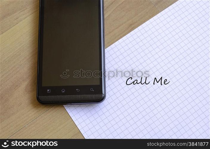 Phone and white sheet notepad on the desk