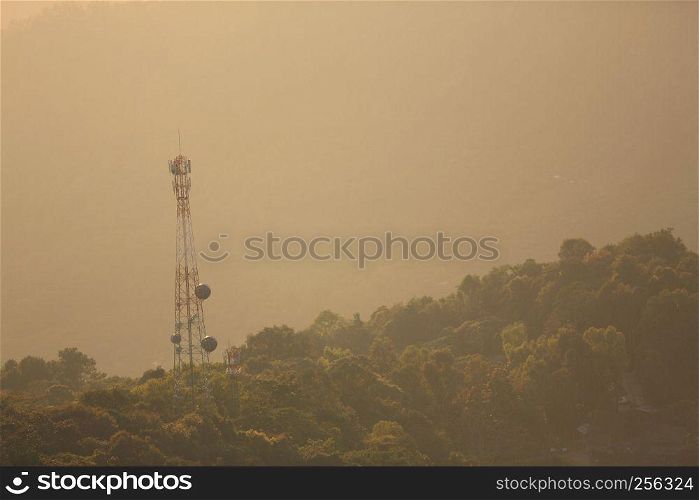 Phone antenna on moutain with sunrise