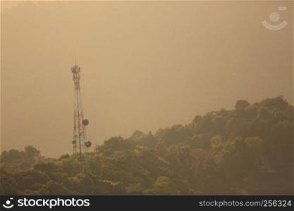 Phone antenna on moutain with sunrise