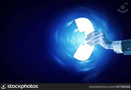 Phone icon. Businessman hand holding calls icon on blue background