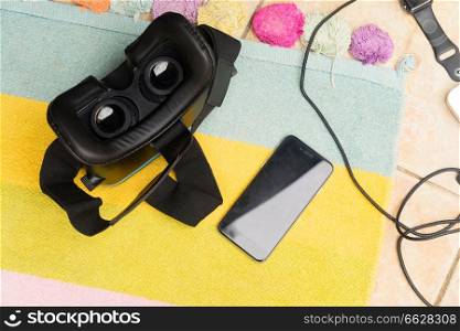 Phone with vr virtual reality black glasses flat lay scene. Gudgets with vr glasses