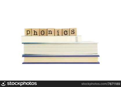 phonics word on wood stamps stack on books, language and reading concepts