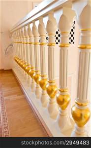 Phot of white and gold balustrade pattern