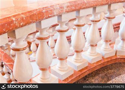 Phot of white and gold balustrade pattern