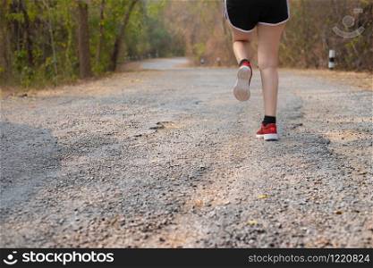 Photo back view sporty Asia young woman wear sports shoes running on old road, Fitness and workout wellness, Healthy lifestyle concept