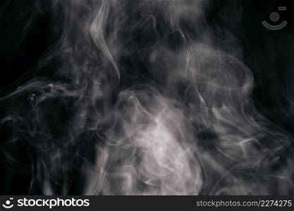 Photo Brown wavy smoke on black background. Resolution and high quality beautiful photo. Photo Brown wavy smoke on black background. High quality beautiful photo concept