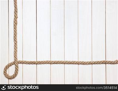 Photo Frame from the rope against the wooden boards